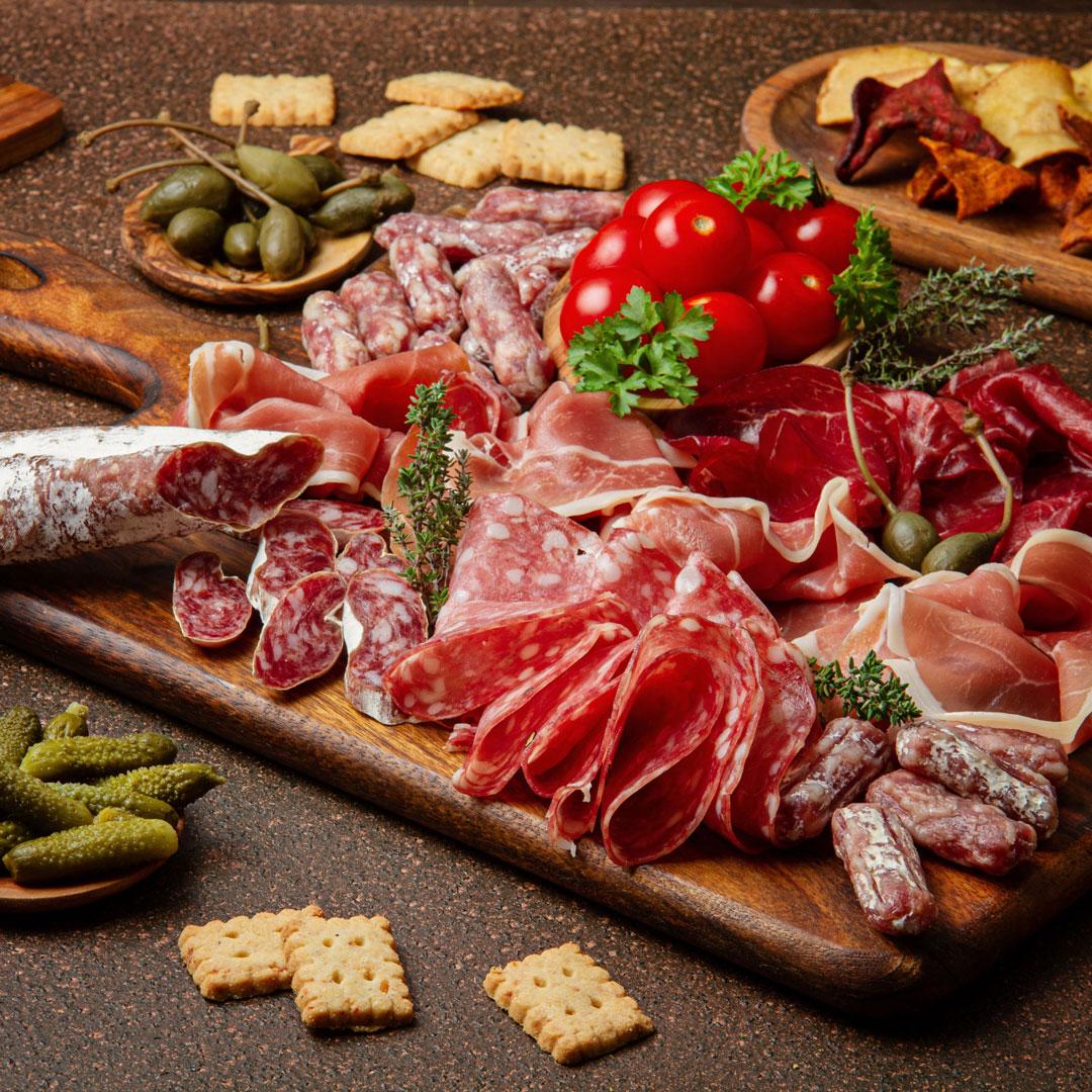 appetizers-table-with-differents-antipasti-cheese-charcuterie-snacks-and-wine-sausage-ham-tapas-olives-cheese-and-crackers-for-buffet-party